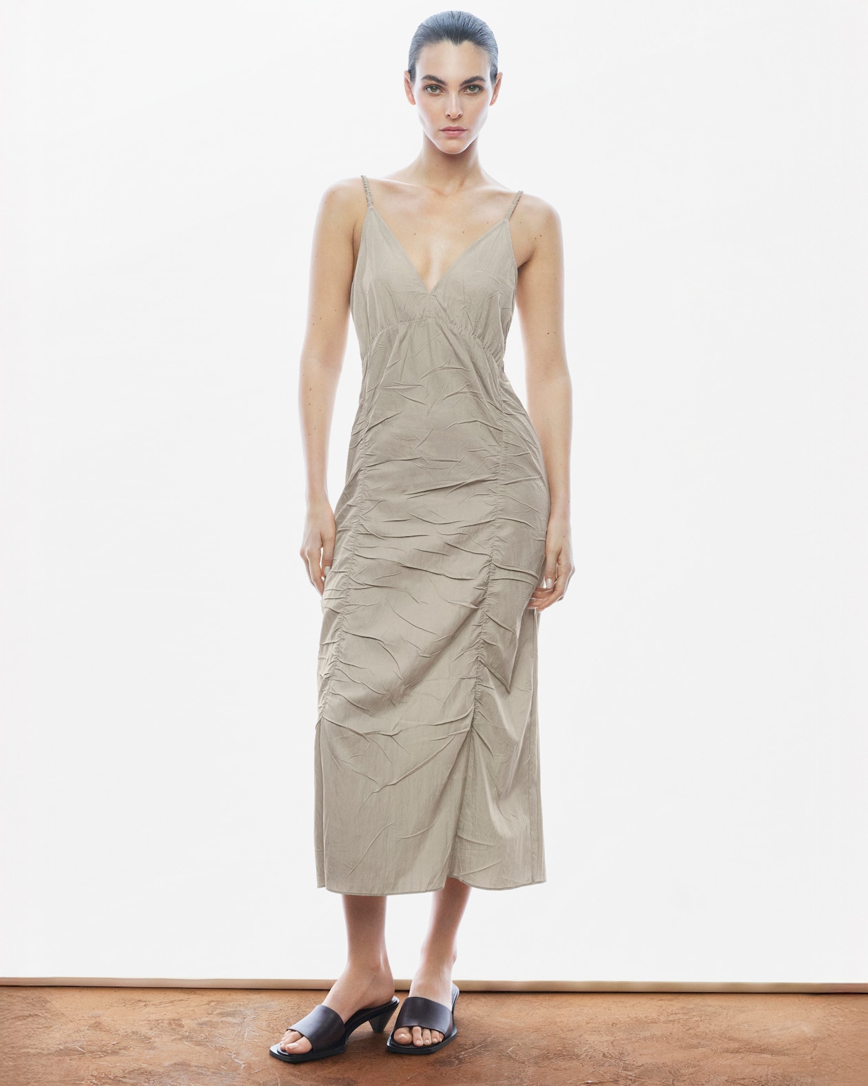 Person wearing grey dress