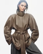 Placeholder for: woman in khaki leather jacket