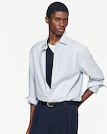 Placeholder for: man wearing light blue stripes shirt