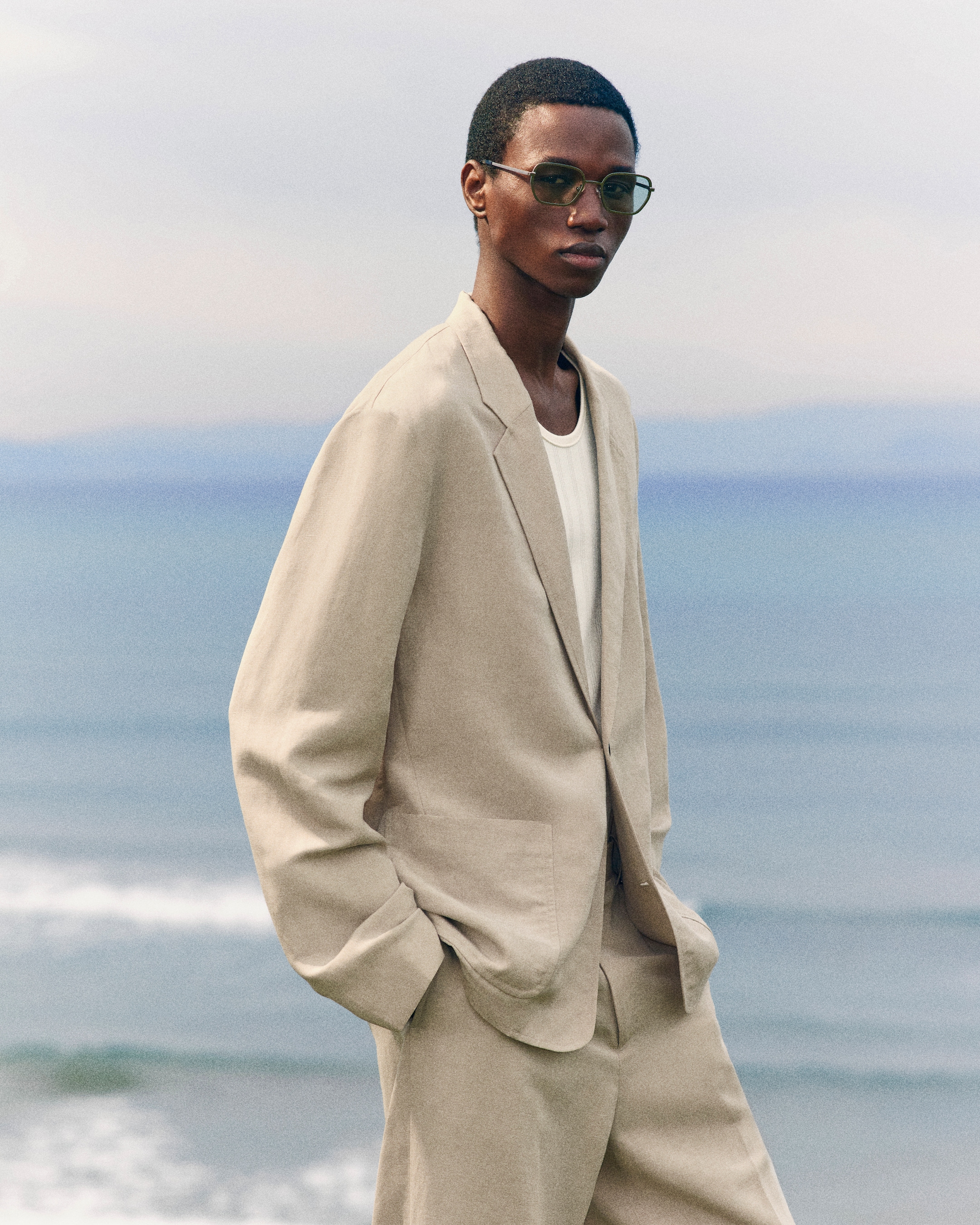 person wearing linen blazer and trousers