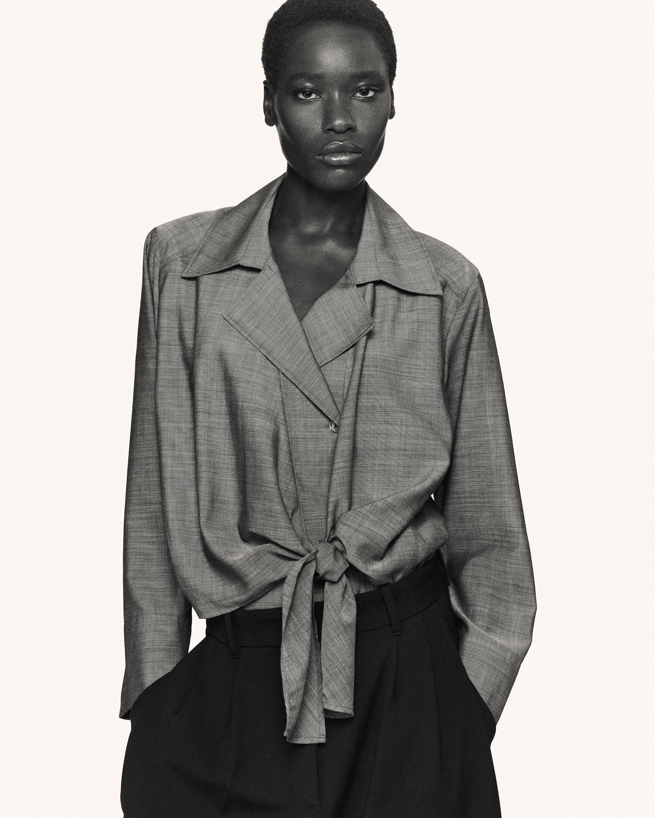 Woman in tie waisted blouse