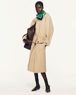 Placeholder for: woman in beige jacket and skirt set