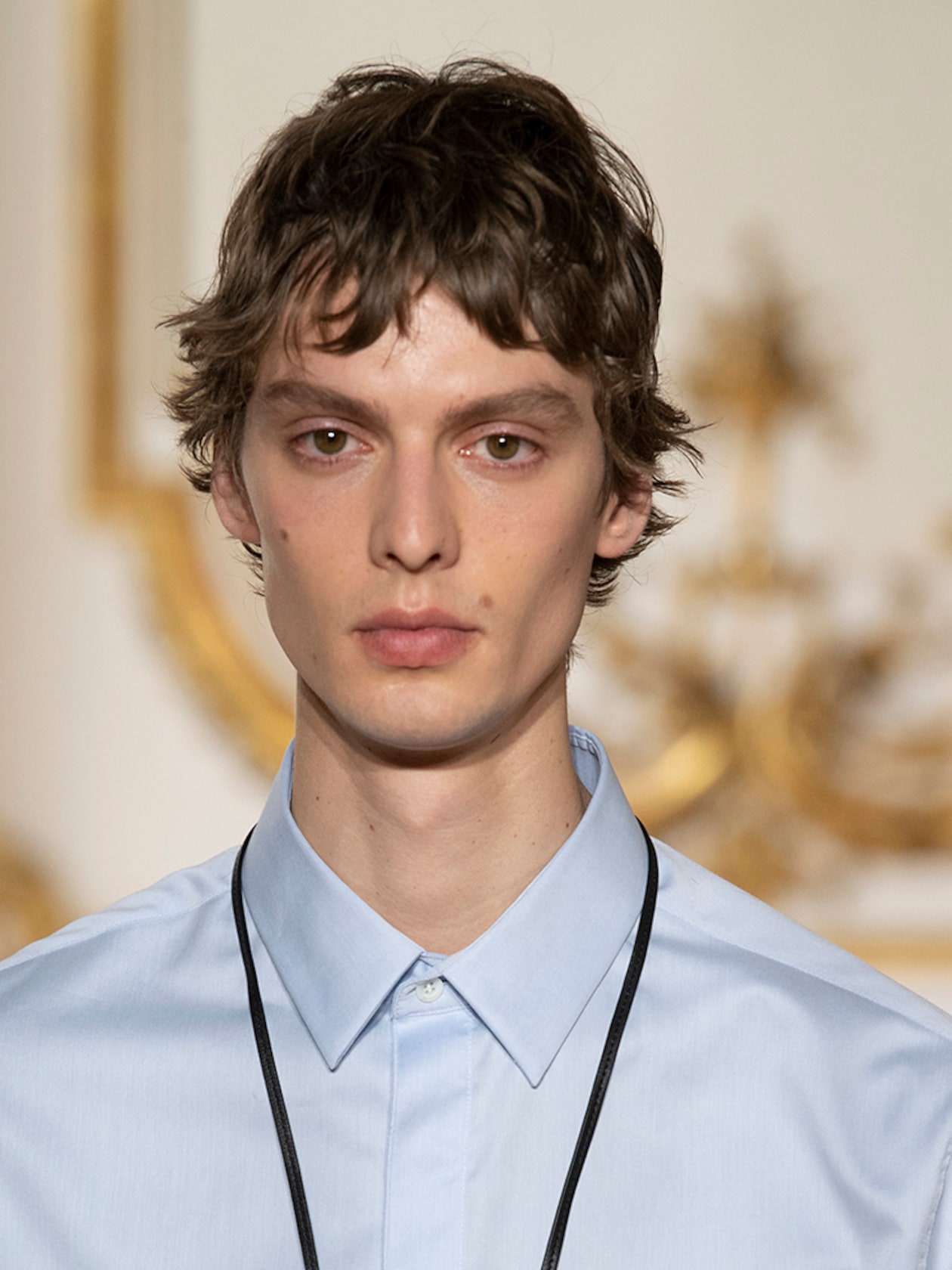Person wearing blue shirt