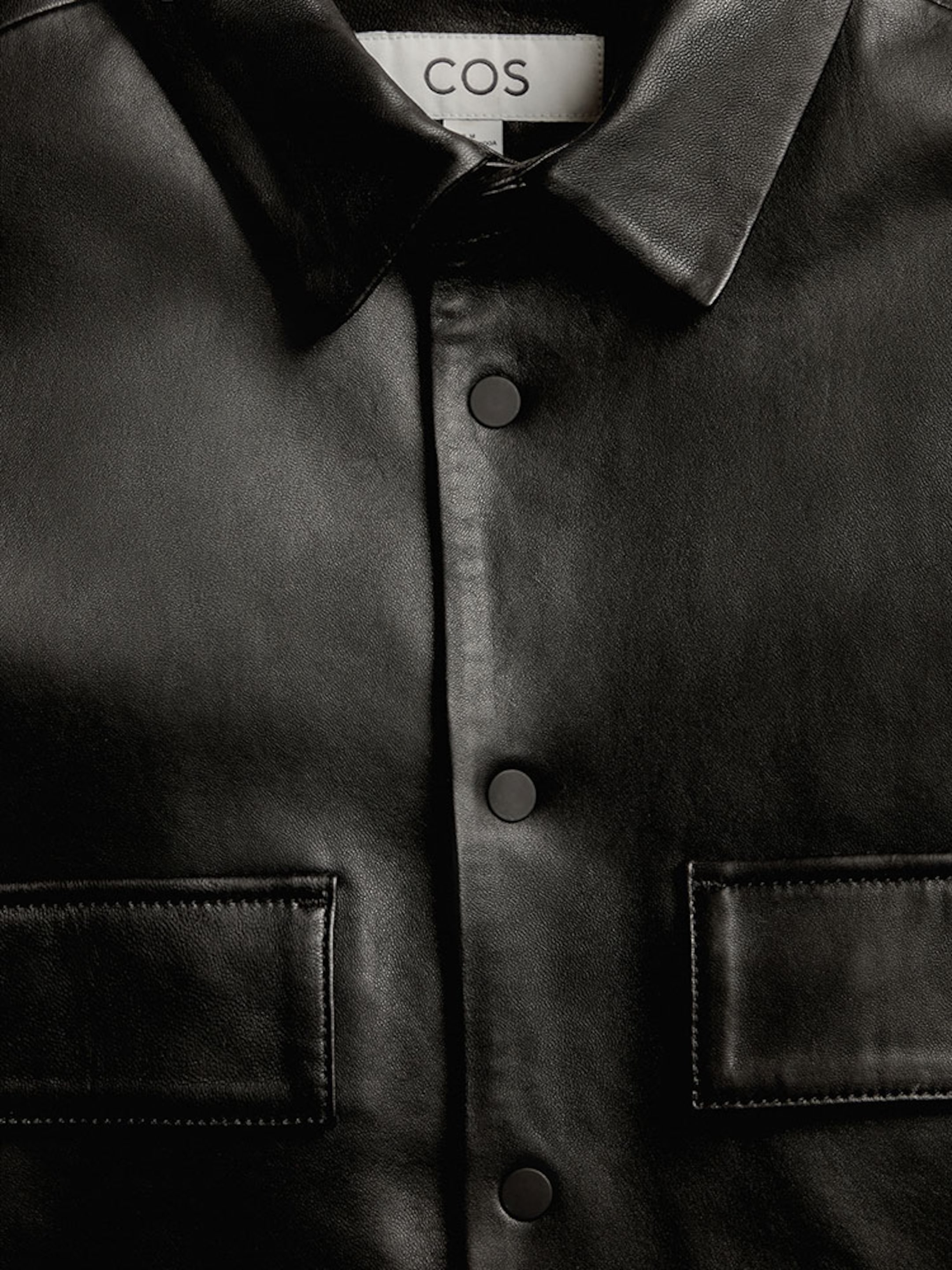 Black leather collared shirt with chest pockets