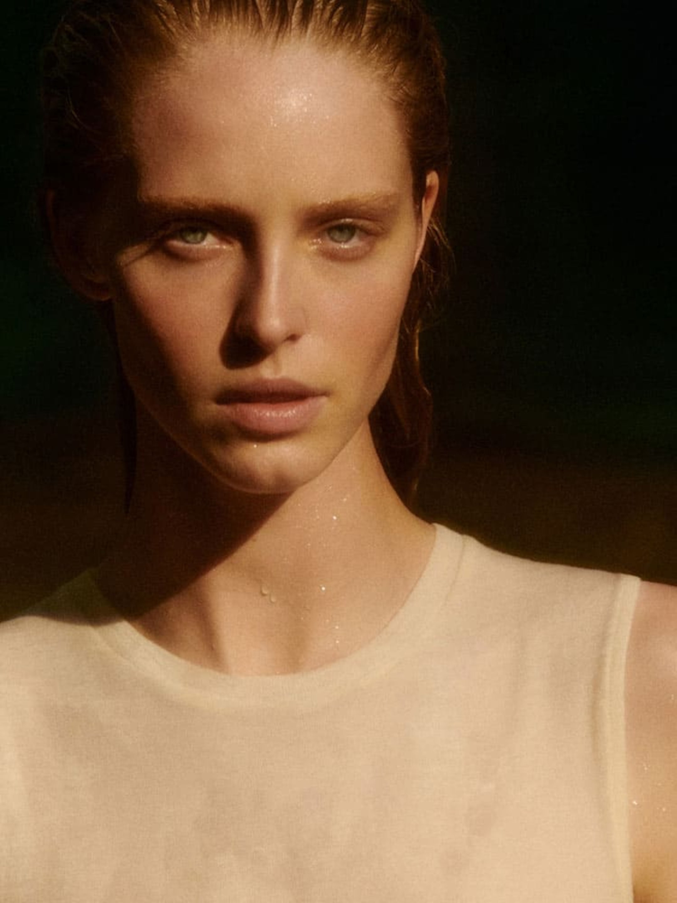 Person wearing white vest