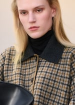 Placeholder for: person wearing check wool coat