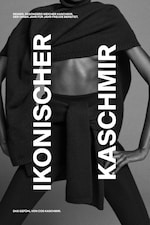 Placeholder for: A person wearing a soft, dark cashmere sweater with "Ikonischer Kaschmir" text overlay on the image.