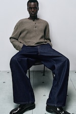 Placeholder for: model wearing wide leg jeans and knitwear jumper