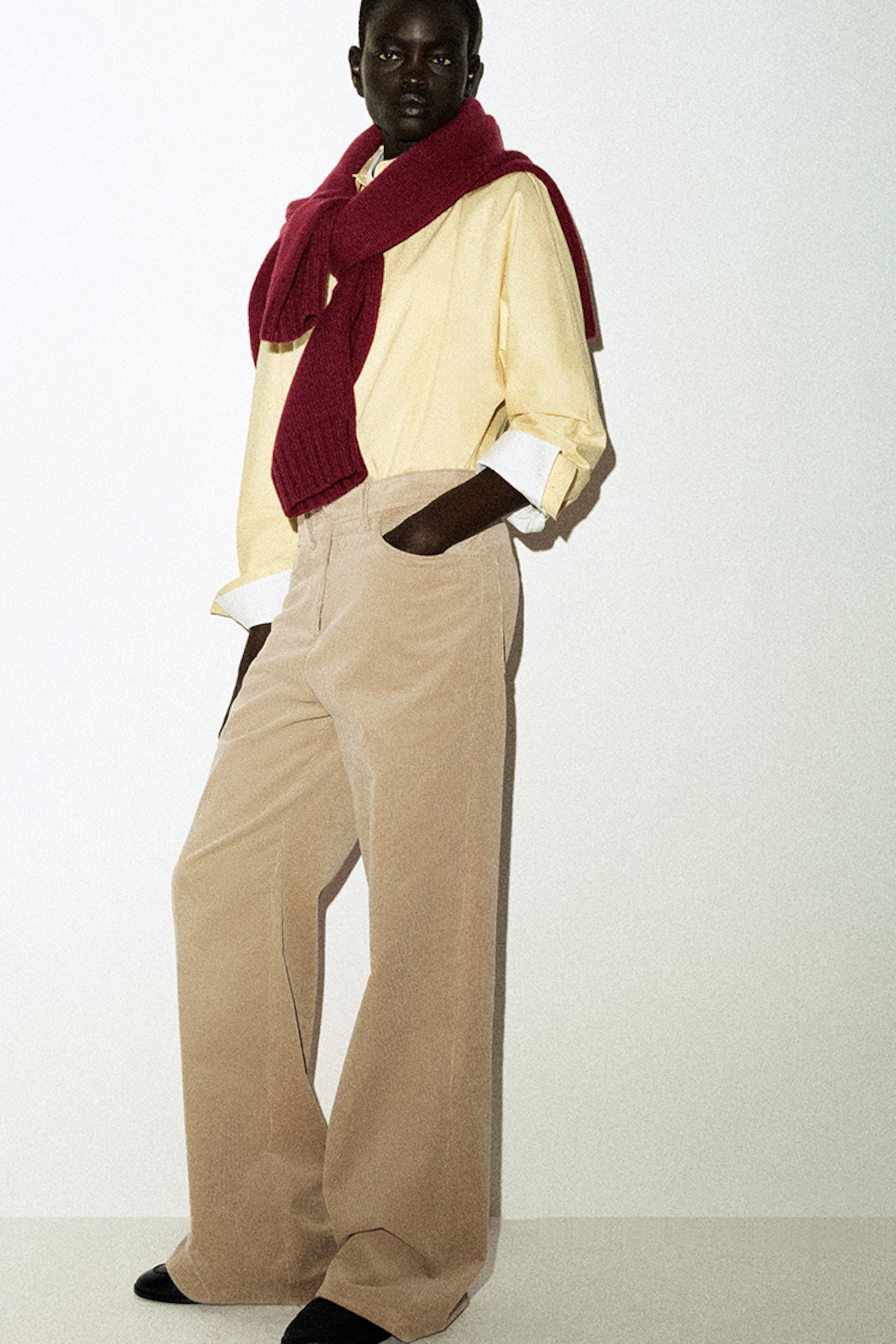 person wearing denim wide leg trousers