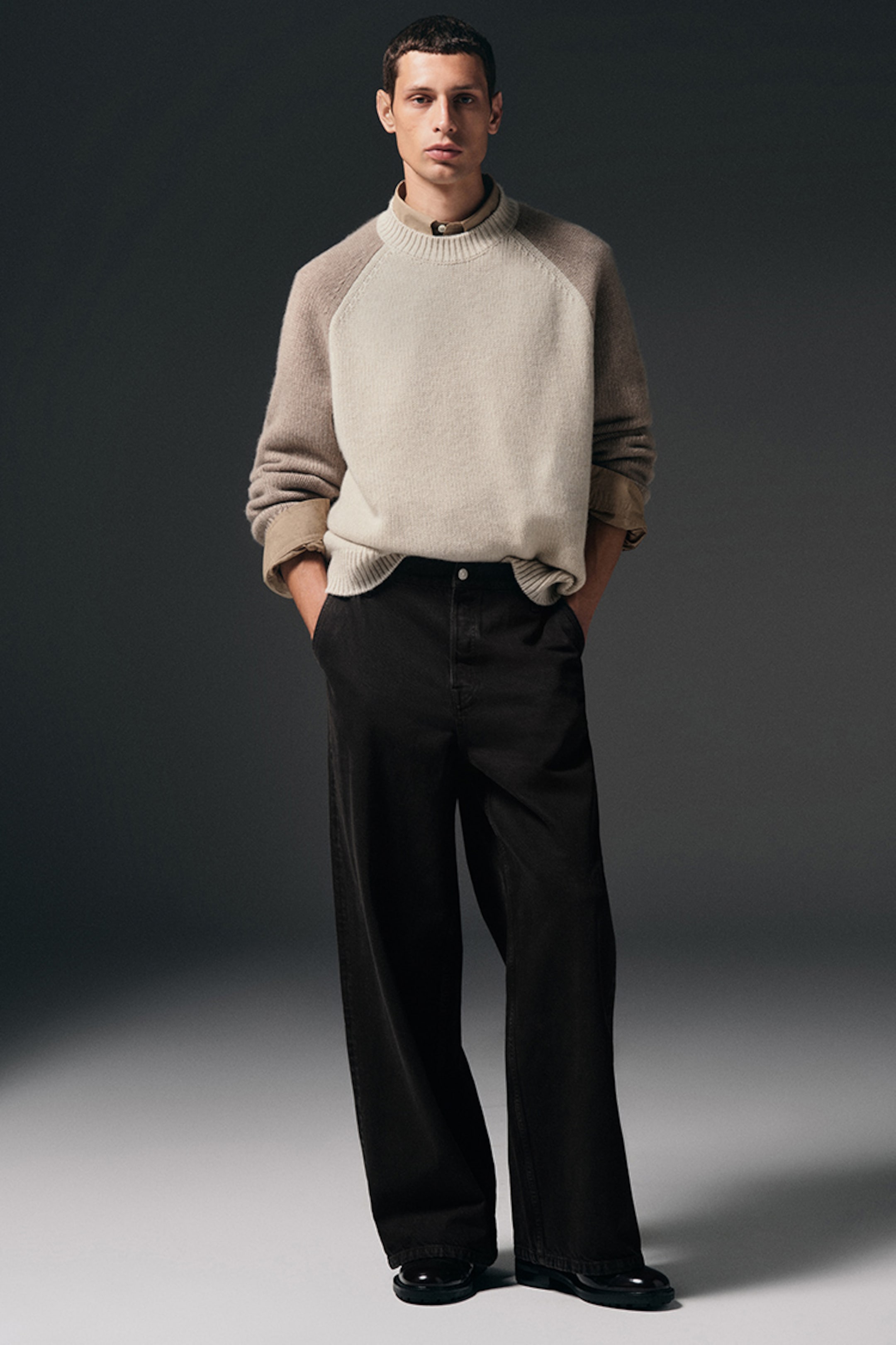 model wearing wide leg jeans and knitwear jumper