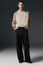 Placeholder for: model wearing wide leg jeans and knitwear jumper