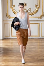 Placeholder for: Person wearing tops and shorts