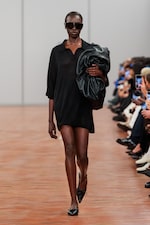 Placeholder for: Person wearing black shirt dress