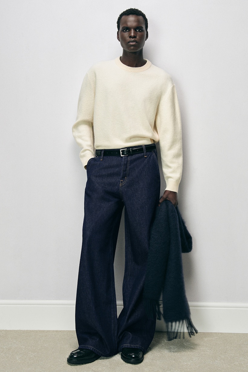 model wearing wide leg jeans and knitwear jumper