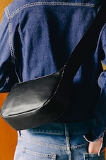 Placeholder for: person holding crossbody leather bag
