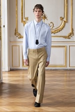 Placeholder for: Person wearing shirt and trousers