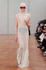 Placeholder for: Person wearing white hoodie dress