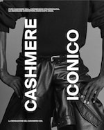 Placeholder for: A black and white image of a person wearing a dark sweater and leather pants with the text "Cashmere Iconico" vertically displayed.