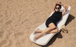 Placeholder for: Woman in black dress with bag
