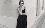 Placeholder for: women standing in black spagetti strap dress